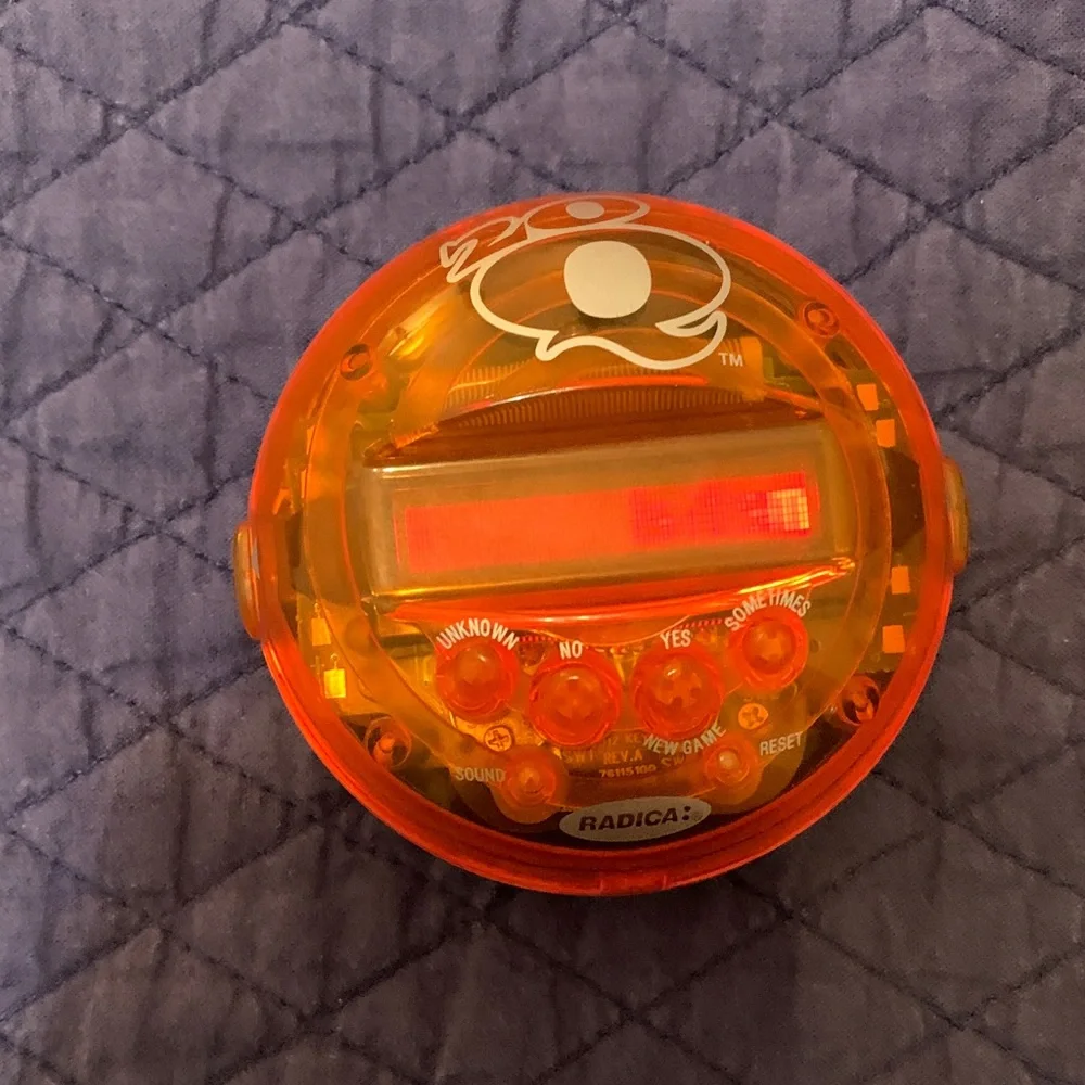 Radica Orange Handheld Electronic Game. 20 questions
